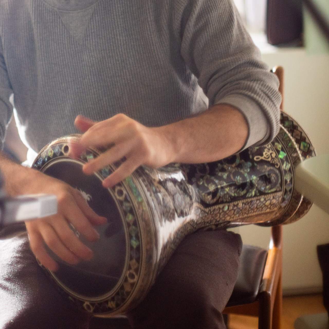 Hands on a darbuka